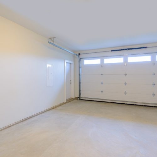 An,Empty,Garage,With,Door,And,Windows.